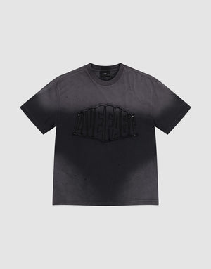 The LFDY Emblem Patch Tee by LIVE FAST DIE YOUNG is a black oversized jersey T-shirt made from 100% cotton, featuring a bold raised 'LIVE FAST' graphic, distressed look with subtle speckles, and a signature logo patch. | plain