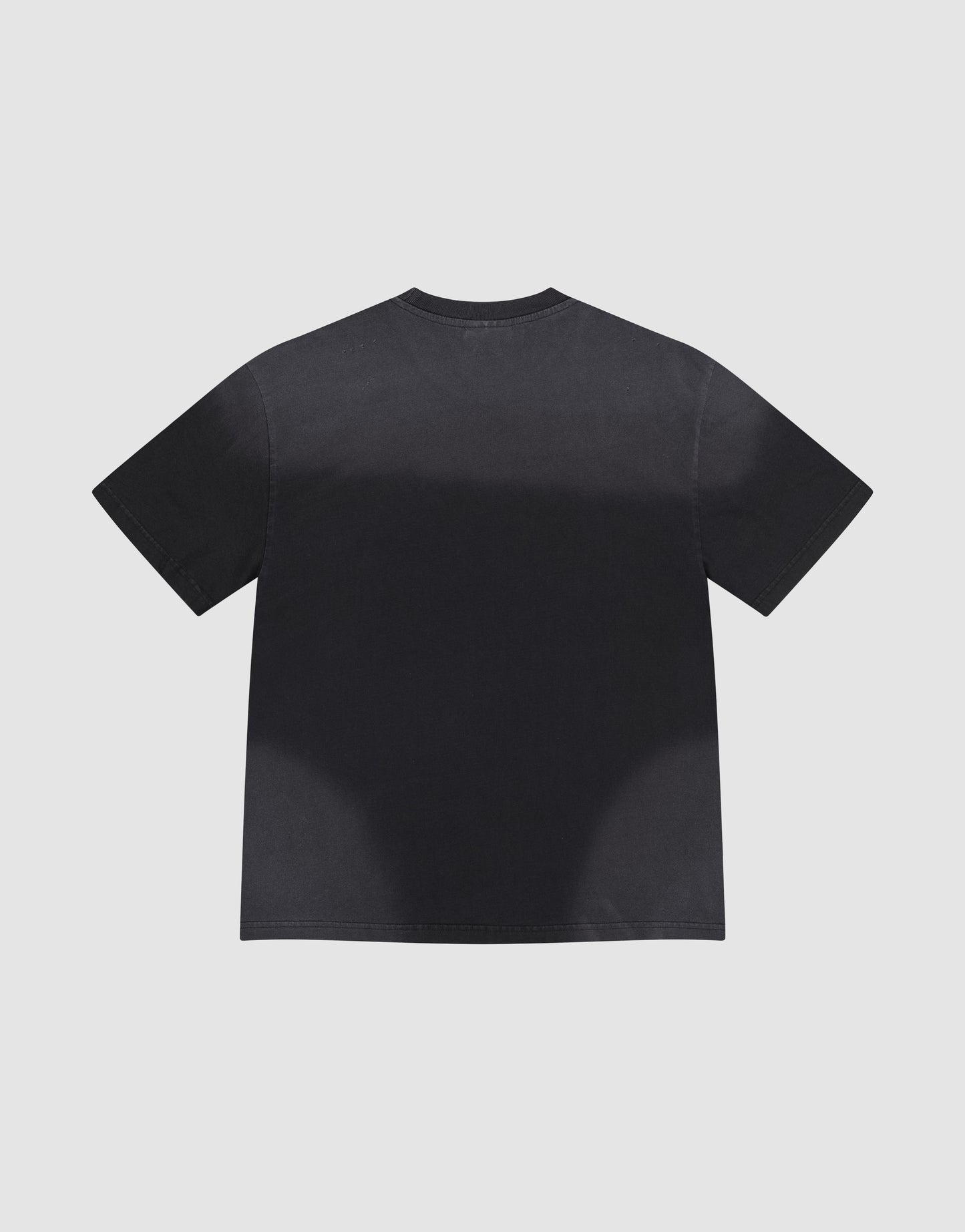 The LFDY Flames Tee by LIVE FAST DIE YOUNG, an oversize fit black short-sleeve t-shirt, is laid flat on a light gray background, showing its plain back with no visible logos or designs.