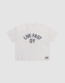 The LFDY Boxy Jersey by LIVE FAST DIE YOUNG features a white mesh, boxy fit, short sleeves, bold black "LIVE FAST DY" lettering on the front, and a small LFDY patch near the hem. Made from 100% polyester for comfort and durability. | plain