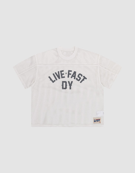 The LFDY Boxy Jersey by LIVE FAST DIE YOUNG features a white mesh, boxy fit, short sleeves, bold black "LIVE FAST DY" lettering on the front, and a small LFDY patch near the hem. Made from 100% polyester for comfort and durability. | plain