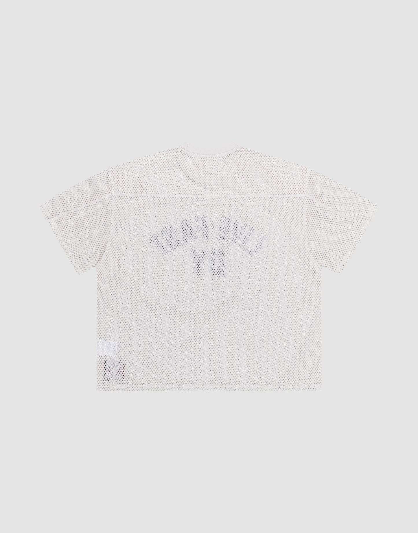 The LFDY Boxy Jersey by LIVE FAST DIE YOUNG is a white mesh T-shirt with a boxy fit, laid flat on a plain gray background. “LIVE FAST” and “D Y” appear in large reversed gray letters on the back, with a small white tag near the bottom hem.