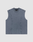The LIVE FAST DIE YOUNG Heavy Muscle Tank is a sleeveless, faded blue-gray vest with a crew neck and subtle seam lines. Made from 100% Baumwolle in an oversize fit, it features a discreet chest logo and is shown flat on a light gray background.