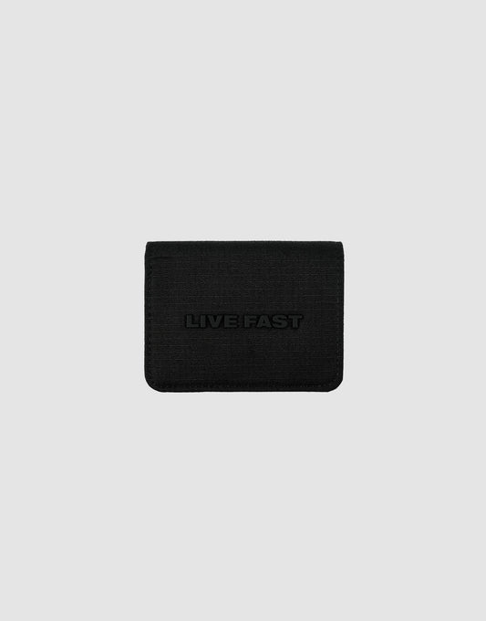 A black LFDY Cardholder by LIVE FAST DIE YOUNG features a textured surface, card slots, and "LIVE FAST" embossed on the front, shown against a plain light gray background.