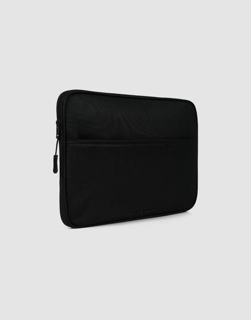 The LFDY Laptop Case by LIVE FAST DIE YOUNG is a black polyester sleeve with a zipper, featuring an Außentasche and protective Laptopfach, shown on a plain light gray background.