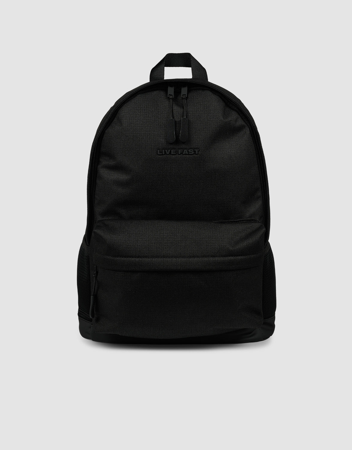 The LFDY Backpack by LIVE FAST DIE YOUNG is a plain black rucksack (19L) with a front zip pocket, small top handle, embossed "LIVEFAST" logo, and verstellbare Schultergurte, shown on a light gray background.