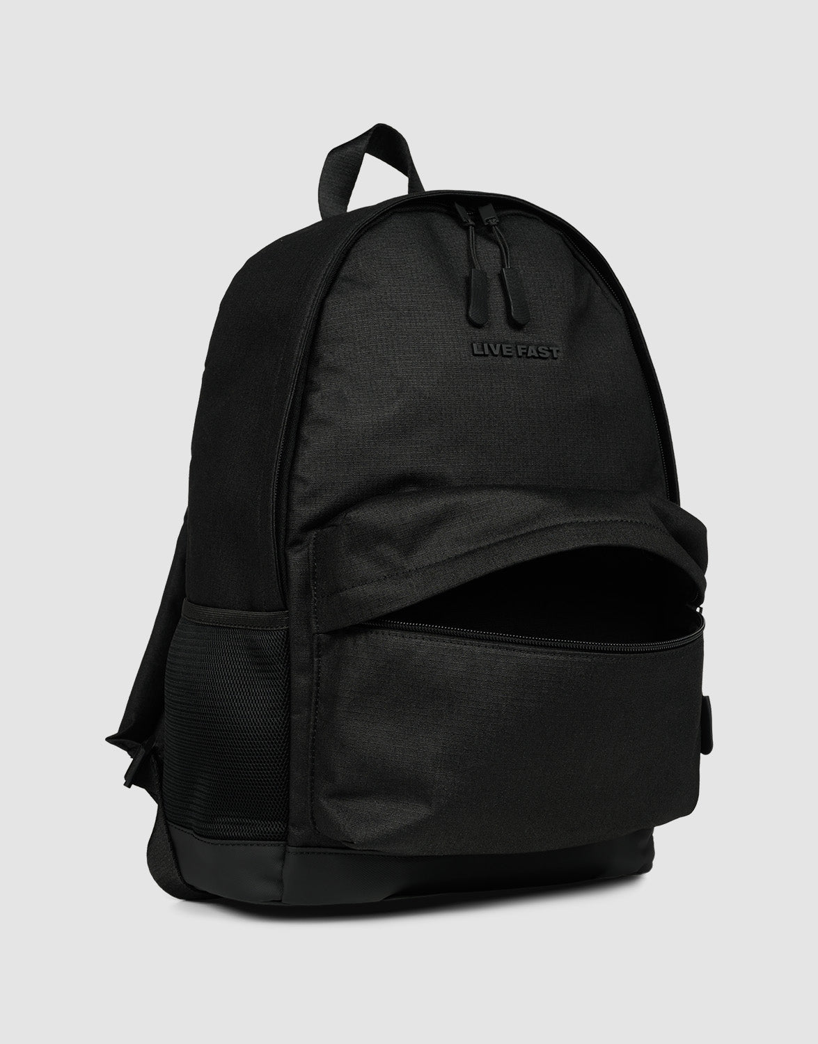 The LFDY Backpack by LIVE FAST DIE YOUNG is a black 19L rucksack with adjustable shoulder straps, a partially open front zip pocket, side mesh pockets, "LIVE FAST" text on the top front, and a top handle. Shown against a plain gray background.