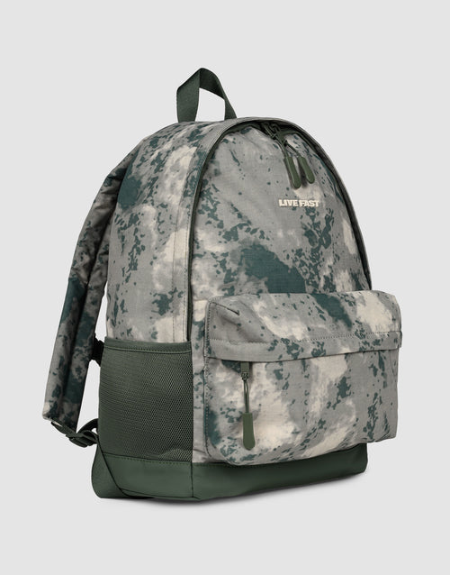 The LFDY Backpack by LIVE FAST DIE YOUNG is a green and gray camo 19L laptop rucksack with a front zipper pocket, side mesh pocket, top handle, adjustable shoulder straps, and "LIVE FAST" text on the front.
