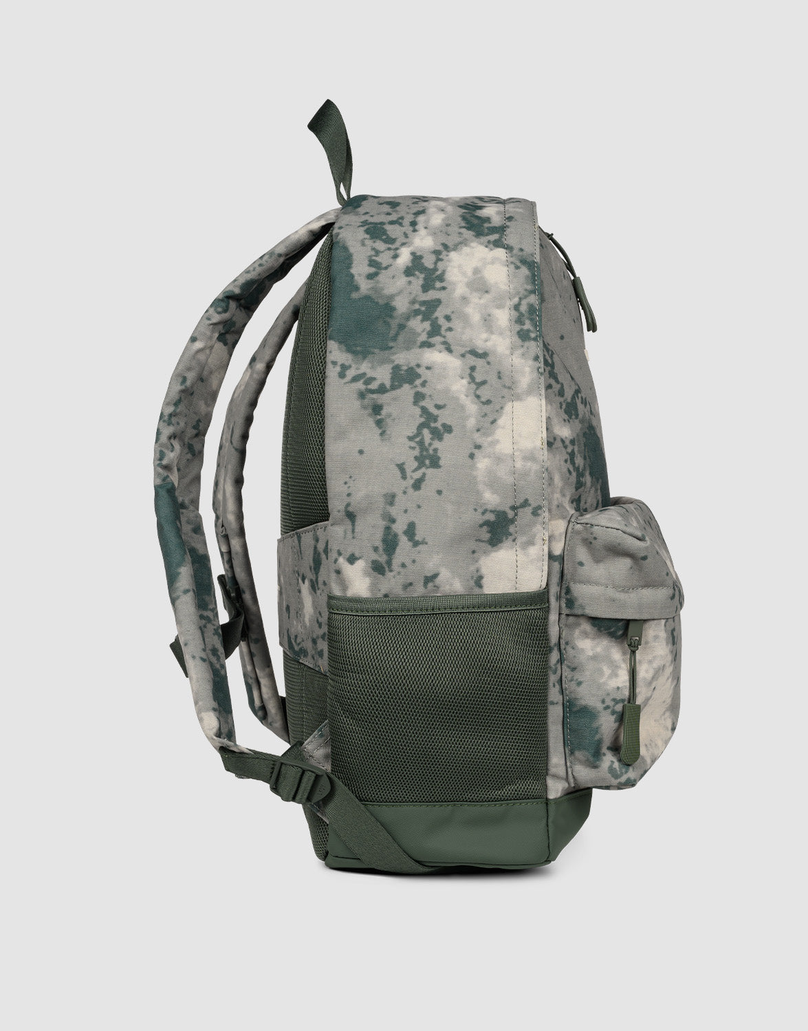 Side view of the 19L LFDY Backpack by LIVE FAST DIE YOUNG in green and gray digital camo, featuring adjustable shoulder straps, front zipper pocket, mesh side pocket, padded straps, and top handle against a light gray background.