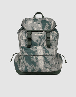 The LFDY Travel Backpack by LIVE FAST DIE YOUNG features a gray-green camo design, black straps, verstellbare Schultergurte, top flap, front pocket with "LIVE FAST" print, and a 25L capacity—ideal for daily essentials.