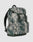 The LFDY Travel Backpack by LIVE FAST DIE YOUNG features a gray and green camo design, front zipper pocket, two buckled straps, side pockets, adjustable shoulder straps, "LIVE FAST" text on the flap, and holds up to 25 liters.