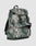 The LFDY Travel Backpack by LIVE FAST DIE YOUNG is a 25L green and gray camo rucksack with front and side pockets, adjustable shoulder straps, top flap closure, and the LIVE FAST brand name on the front.