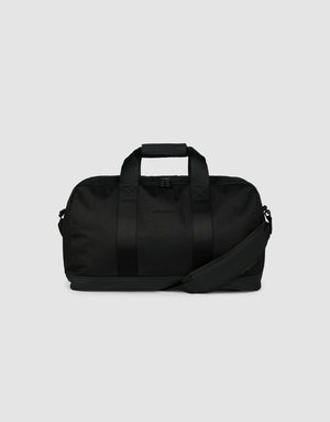 The LFDY Weekender 50 by LIVE FAST DIE YOUNG is a black 30L bag with two handles, a detachable shoulder strap, and a zippered main compartment, shown against a plain light gray background.
