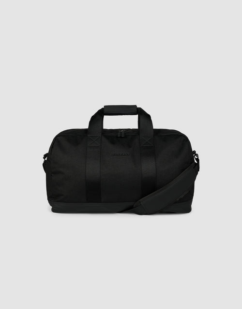 The LFDY Weekender 50 by LIVE FAST DIE YOUNG is a black 30L bag with two handles, a detachable shoulder strap, and a zippered main compartment, shown against a plain light gray background.