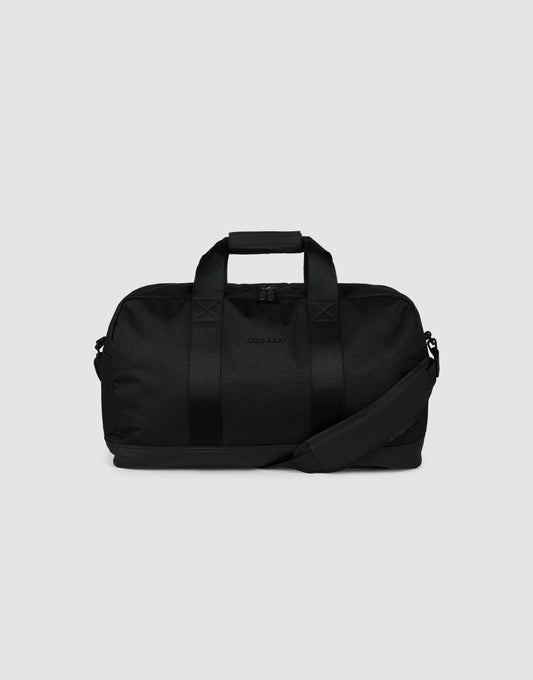 The LFDY Weekender 50 by LIVE FAST DIE YOUNG is a black 30L bag with two handles, a detachable shoulder strap, and a zippered main compartment, shown against a plain light gray background.