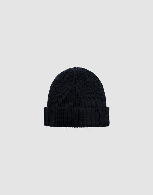 The Double Rib Knit Beanie by LIVE FAST DIE YOUNG is a black, 100% cotton hat with a folded brim, shown on a plain light gray background for a voluminous look.