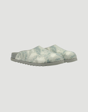 The LFDY Mules by LIVE FAST DIE YOUNG feature a gray and white marbled PU upper, ridged EVA sole, and closed toe design, shown against a plain white background.