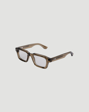 The LFDY x Chimi Shades 03 by LIVE FAST DIE YOUNG are translucent brown rectangular eyeglasses with thick acetate frames and clear lenses, shown at an angle on a plain white background highlighting front and side details.