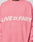 Someone wears the Live Fast Boucle Sweater by LIVE FAST DIE YOUNG—an oversize pink knit featuring "LIVE FAST" in bold white lettering across the chest.