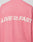 The LIVE FAST DIE YOUNG Live Fast Boucle Sweater is an oversized pink knit with "LIVE FAST" in bold white letters across the back, separated by a small running shoe graphic.
