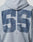 A close-up of the back of the LIVE FAST DIE YOUNG LFDY 55 Hooded Zip in light blue Oversize Fit, with a large distressed navy number 55 and small LFDY below, finished in vintage-washed cotton.