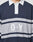 A person wearing the LFDY Striped Polo by LIVE FAST DIE YOUNG, featuring navy blue and gray stripes, a white collar, and D Y embroidered on the front. The image is cropped to display only the upper torso.