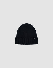 The LIVE FAST DIE YOUNG Double Rib Knit Beanie in black features a ribbed texture, folded brim, and a small black tag with white text, all displayed on a plain light gray background for a voluminous look.