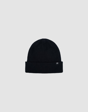 The LIVE FAST DIE YOUNG Double Rib Knit Beanie in black features a ribbed texture, folded brim, and a small black tag with white text, all displayed on a plain light gray background for a voluminous look.