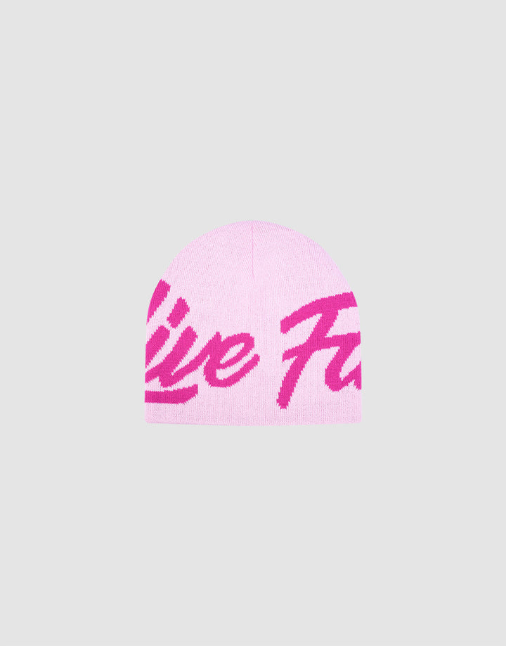 The LFDY Jacquard Beanie by LIVE FAST DIE YOUNG features light pink polyacryl fabric with bold, dark pink cursive Logo Strick lettering across the front, shown on a plain gray background. 