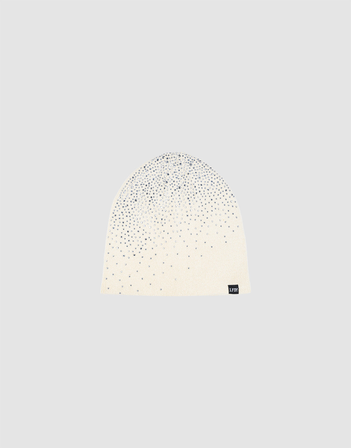 The LFDY Rhinestone Beanie by LIVE FAST DIE YOUNG is a white 100% Baumwolle knit, adorned with silver rhinestones and finished with a small black flag-label, shown on a plain light gray background.