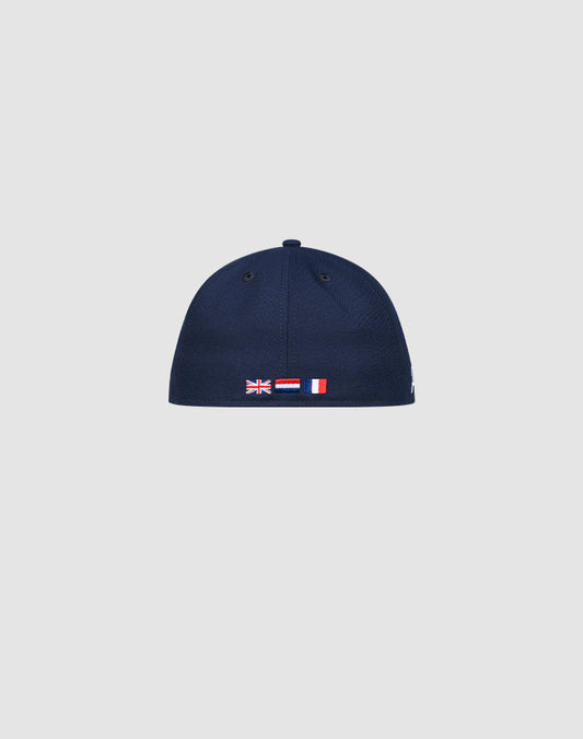 The LFDY x New Era 59Fifty Low Profile Paris cap by LIVE FAST DIE YOUNG is shown from the back with small embroidered UK, Poland, and France flags above the bottom edge against a plain light gray background.
