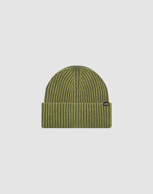 The LIVE FAST DIE YOUNG Washed Rib Knit Beanie in olive green features a ribbed knit design, folded cuff, and a small black flag label, all crafted from 100% Baumwolle and shown on a plain light gray background.