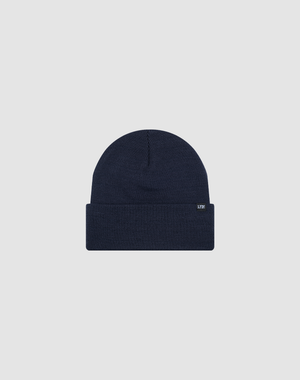 The LIVE FAST DIE YOUNG Basic Beanie in navy blue features a folded brim and a small rectangular flag label on the cuff, shown in one size against a plain light gray background.