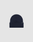 The LIVE FAST DIE YOUNG Basic Beanie in navy blue features a folded brim and a small rectangular flag label on the cuff, shown in one size against a plain light gray background.