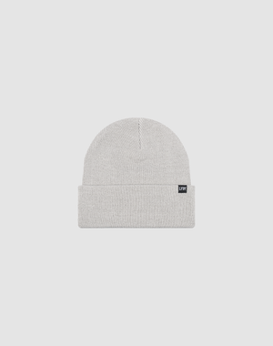 The LIVE FAST DIE YOUNG Basic Beanie is a light gray knit, one size, with a folded cuff and a small black rectangular flag-label, shown against a plain white background.