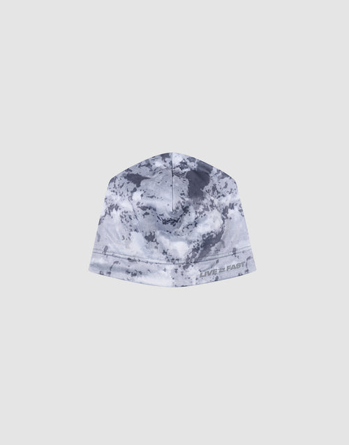 The Live Fast Performance Beanie by LIVE FAST DIE YOUNG features gray and white camo, a soft fleece lining, and “LIVE FAST” printed near the edge, shown against a plain light background.
