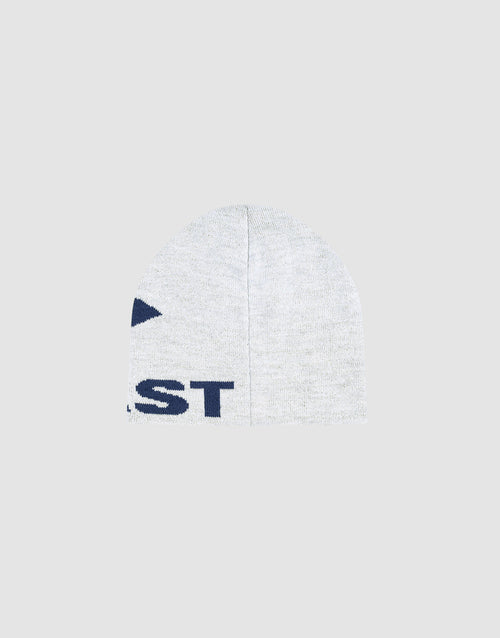 The Live Fast LF Beanie by LIVE FAST DIE YOUNG is a light gray polyacryl knit with partial navy blue jacquard artwork and text on the left side, shown on a plain light gray background.