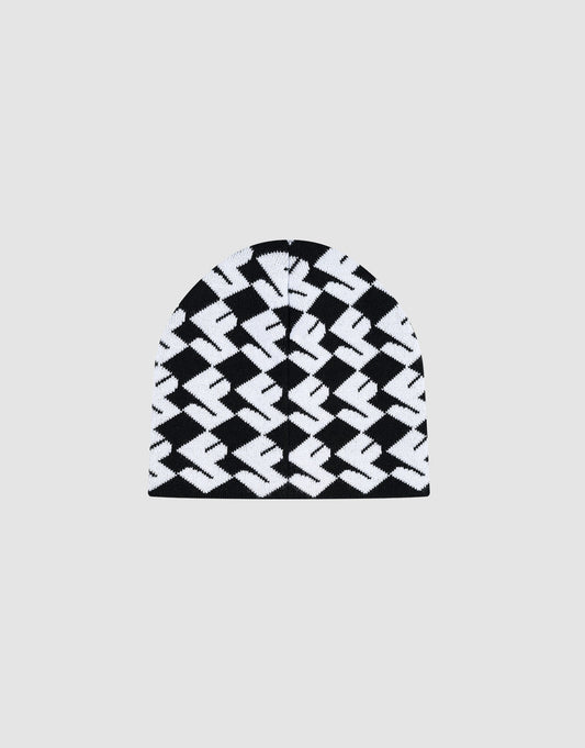 The LF Monogram Beanie by LIVE FAST DIE YOUNG is a black and white Polyacryl knit featuring a bold geometric zigzag Jacquard Monogram Muster pattern and subtle Flaglabel, shown on a plain light gray background.