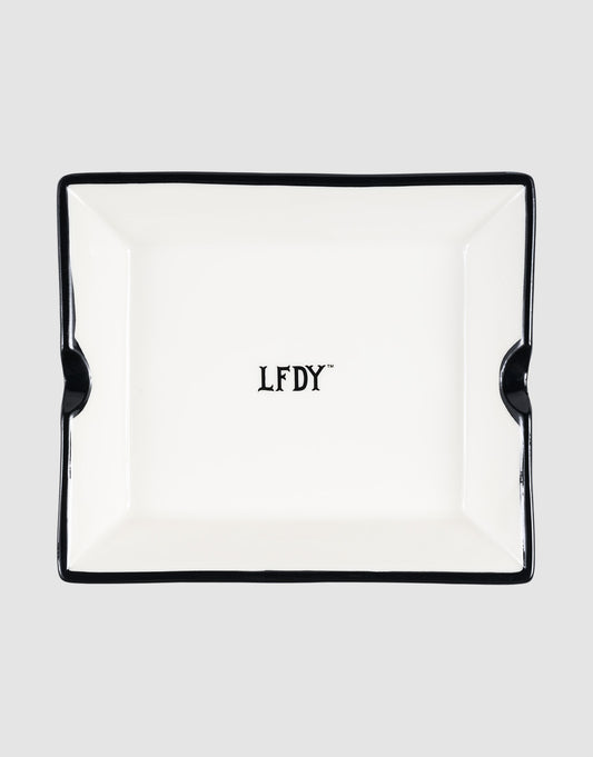 The LFDY Ashtray by LIVE FAST DIE YOUNG is a rectangular white porcelain ashtray with black trim, two notches, and a central black "LFDY" logo. Model: LF2603-20136.