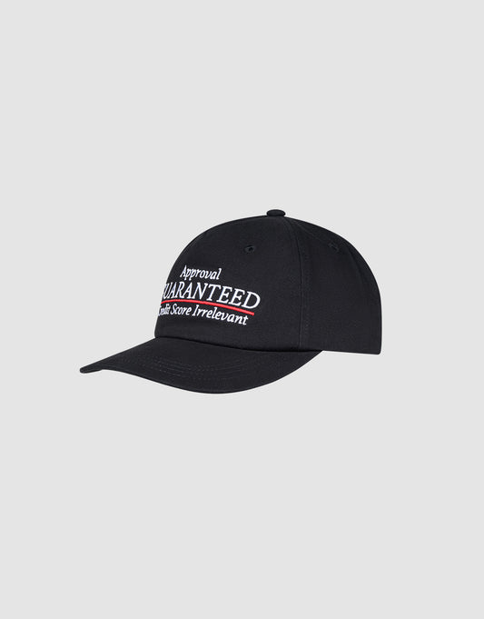 The LFDY Guaranteed Cap by LIVE FAST DIE YOUNG is a black unstructured 5-panel cap made from 100% polyester, with “Approval GUARANTEED Credit Score Irrelevant” embroidered in white and red, and a snap closure for an adjustable fit.