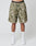 A person wears LIVE FAST DIE YOUNGs Live Fast Nylon Shorts in green camo with side pockets, paired with LIV text white socks, white sneakers, and black waistband underwear reading LIVE FAST. Photo is waist-down against a plain backdrop.