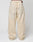 A person is shown from the back wearing LIVE FAST DIE YOUNGs LFDY Baggy Denim in light beige with a baggy fit and wide straight leg. Made from 100% Baumwolle, these jeans have two large back pockets and a brown leather patch on the waistband.