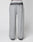 LIVE FAST DIE YOUNG’s Live Fast Boucle Pants feature a wide fit, straight leg, single front pocket, elastic waistband with text, and a gradient from dark to light gray at the waist and ankles. Displayed on a plain background.