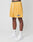 A person wears yellow LFDY Oval Mesh Shorts by LIVE FAST DIE YOUNG, featuring an elastic waistband and LIVE FAST text, paired with white socks with black LFDY text and white sneakers, standing against a plain white background.