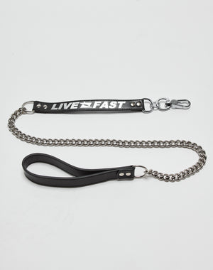 The LFDY Dog Leash by LIVE FAST DIE YOUNG features an Edelstahl metal chain, leather details with a black handle, and a black tag reading LIVE FAST in bold white letters, shown against a plain white background.