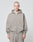A person with a shaved head wears the LIVE FAST DIE YOUNG Basic Script Hooded Zip—a loose-fitting, gray Baumwolle-Polyester hoodie and sweatpants—standing against a light gray background, looking at the camera with a neutral expression.