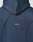 A close-up of the back of the navy LFDY Active Fleece Hooded Zip by LIVE FAST DIE YOUNG, featuring prominent stitching and a small white LIVE FAST logo print at the center.