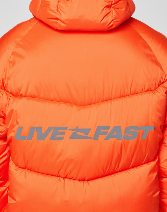 Back view of the Live Fast Puffer Jacket by LIVE FAST DIE YOUNG—an orange, oversized fit with bold, reflective "LIVE FAST" print across the back.