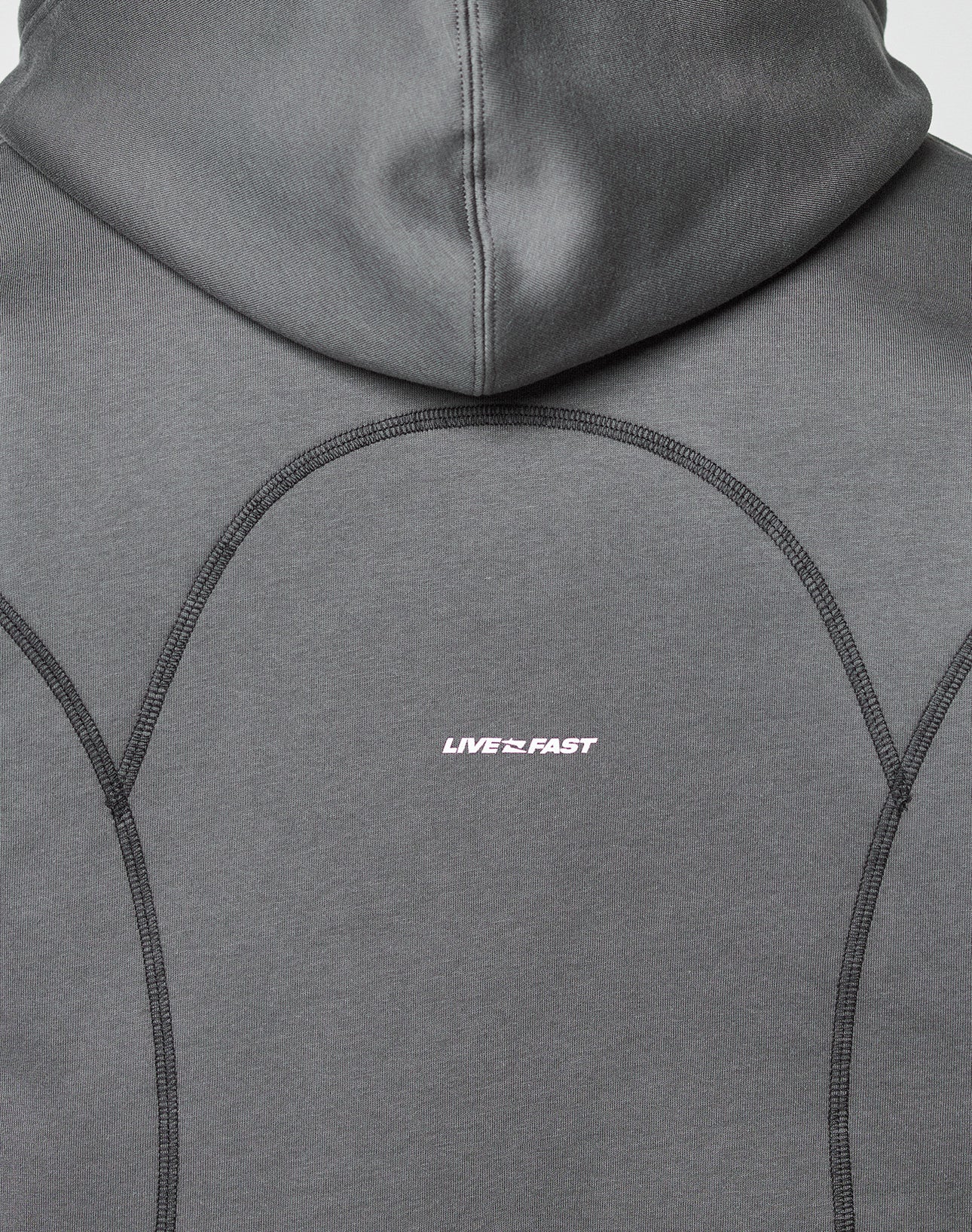 Close-up of the LFDY Active Fleece Hooded Zip by LIVE FAST DIE YOUNG, featuring a gray oversize fit with black stitching and LIVE FAST printed in small white text. Made from 100% Baumwolle for comfort and style.