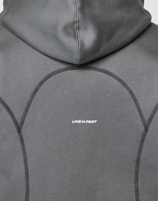 Close-up of the LFDY Active Fleece Hooded Zip by LIVE FAST DIE YOUNG, featuring a gray oversize fit with black stitching and LIVE FAST printed in small white text. Made from 100% Baumwolle for comfort and style.