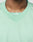 Close-up of a person wearing the Basic Mesh Jersey by LIVE FAST DIE YOUNG. This light green, 100% polyester mesh top features LFDY branding on the collar and showcases its oversized fit around the neckline and upper chest.